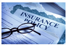 insurance policy and reading glasses
